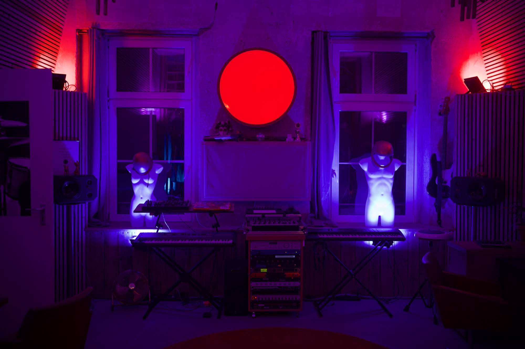 The Live Lab studio in Leipzig at night: the round red lamp between two windows